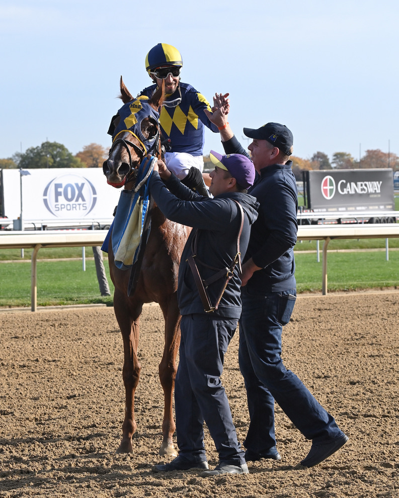 Living Magic & Reuben Silvera greeted by Phil Schoenthal heading to the Winner's Circle